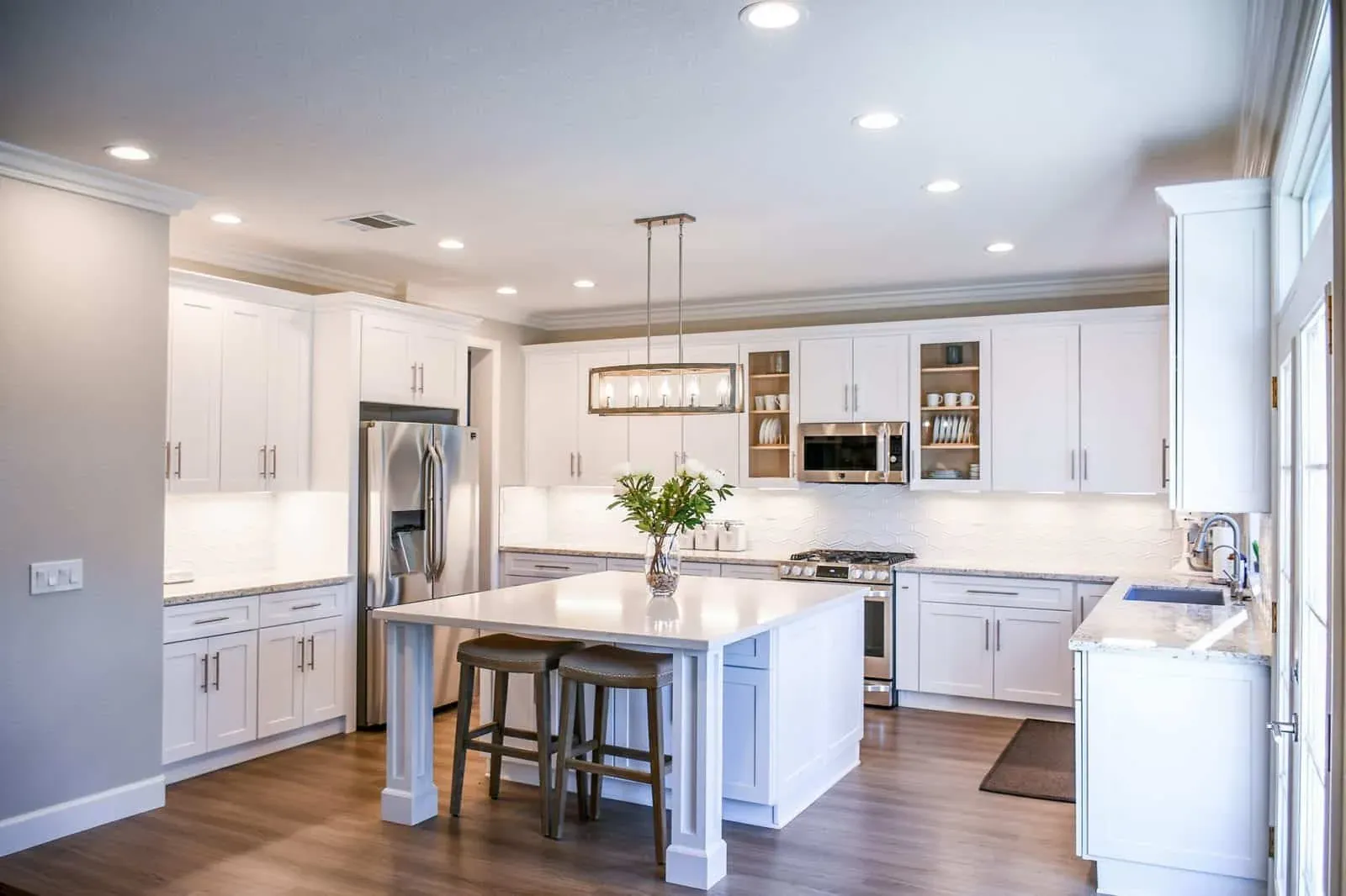 Wood flooring running through an open plan Anaheim living and dining space