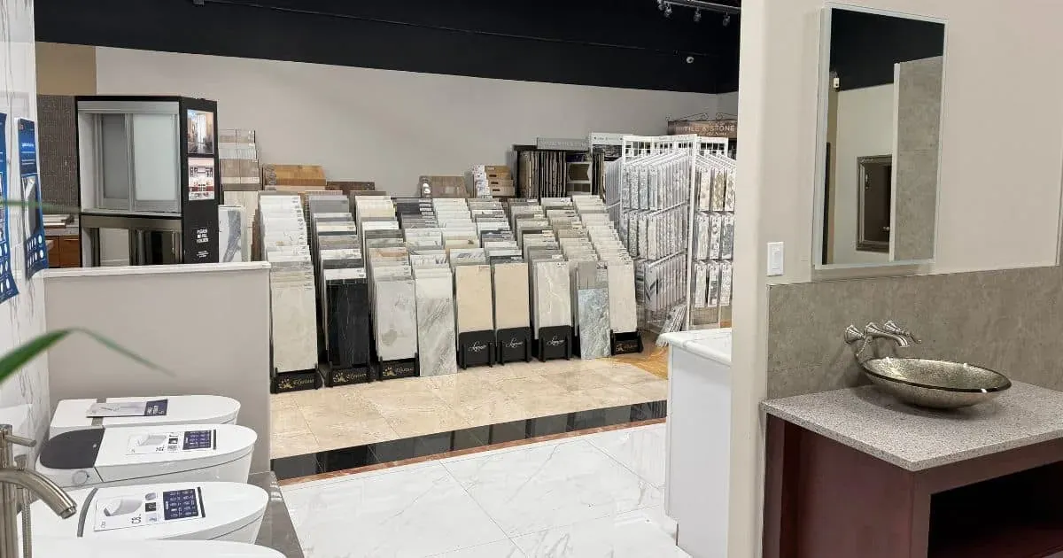 Countertop and tile sample boards displayed in rows on the Anaheim showroom floor