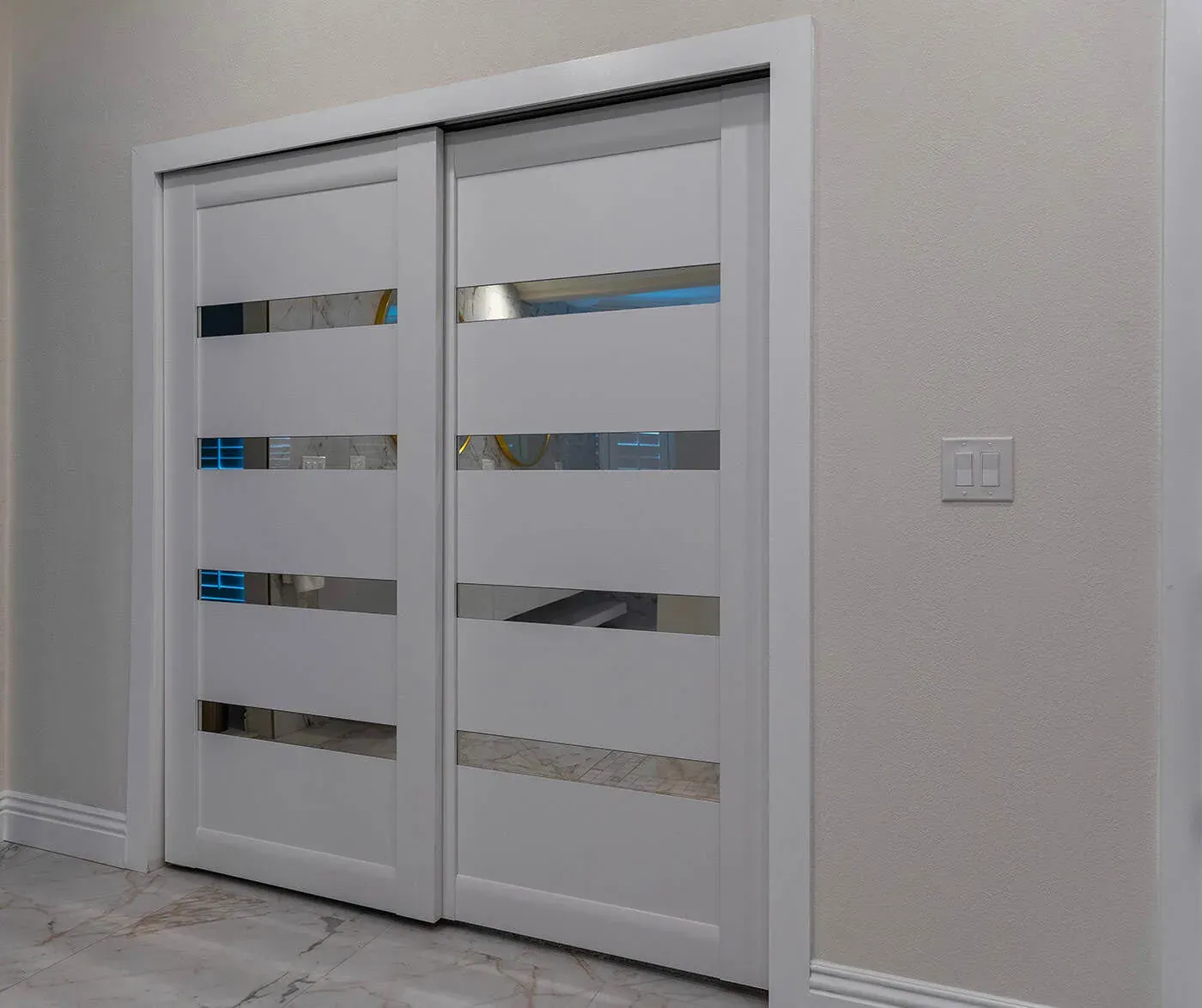 Frosted glass sliding door set in a white frame
